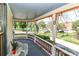 Charming curved front porch with a view of the lush surroundings at 235 Walnut St, Statesville, NC 28677