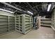 Unfinished basement with ample built-in shelving units at 215 N Main St, Belmont, NC 28012