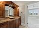 Bathroom with a modern vanity and a view into a bedroom at 215 N Main St, Belmont, NC 28012