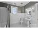 Classic bathroom with white subway tile and pedestal sink at 215 N Main St, Belmont, NC 28012