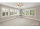 Bright bedroom with hardwood floors and plantation shutters at 215 N Main St, Belmont, NC 28012