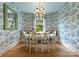 Charming breakfast nook with toile wallpaper and a built-in window seat at 215 N Main St, Belmont, NC 28012