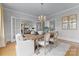 Elegant dining room with a rustic wooden table and access to the living room at 215 N Main St, Belmont, NC 28012