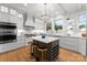 Updated kitchen featuring white cabinets and an island at 215 N Main St, Belmont, NC 28012