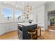Eat-in kitchen with white cabinets and gray island at 215 N Main St, Belmont, NC 28012
