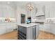 Modern kitchen with white cabinets and large island at 215 N Main St, Belmont, NC 28012