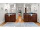 Luxurious bathroom with and vanities and dark wood cabinets at 215 N Main St, Belmont, NC 28012