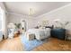 Spacious main bedroom with hardwood floors, and a sitting area at 215 N Main St, Belmont, NC 28012