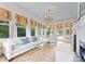 Sunroom with comfy seating and access to the pool at 215 N Main St, Belmont, NC 28012