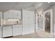 Bonus room wet bar with white shaker cabinets and granite countertop at 215 N Main St, Belmont, NC 28012