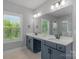 Elegant bathroom with double vanity, quartz countertop and large shower at 4212 Linville Way, Fort Mill, SC 29707