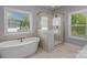 Spa-like bathroom featuring a soaking tub and walk-in shower at 4212 Linville Way, Fort Mill, SC 29707