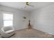 bedroom with unique wall decor and plush armchair at 4212 Linville Way, Fort Mill, SC 29707