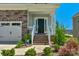 House exterior with stone facade and welcoming front porch at 4212 Linville Way, Fort Mill, SC 29707