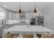 Modern kitchen with stainless steel appliances and an island at 4212 Linville Way, Fort Mill, SC 29707