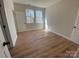 Bedroom with neutral walls and two windows providing plenty of natural light at 814 W Raleigh W Ave, Statesville, NC 28677