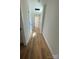 Hallway with dark hardware and light laminate floor at 814 W Raleigh W Ave, Statesville, NC 28677