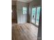 Cozy room with a sliding glass door, stylish wainscoting and luxury vinyl plank flooring at 814 W Raleigh W Ave, Statesville, NC 28677
