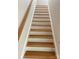 Carpet-free staircase with solid wood steps and white risers at 814 W Raleigh W Ave, Statesville, NC 28677