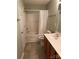 A clean bathroom features a shower and tub combination with vanity and sink at 10875 Holly Ridge Blvd, Charlotte, NC 28216