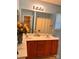 Well lit primary bathroom with a double sink vanity and a large mirror at 10875 Holly Ridge Blvd, Charlotte, NC 28216