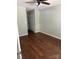 An inviting bedroom is shown with neutral walls, wood-look floors, and closet at 10875 Holly Ridge Blvd, Charlotte, NC 28216