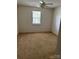 Spacious bedroom with a window and carpet flooring at 10875 Holly Ridge Blvd, Charlotte, NC 28216
