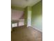A bright bedroom is shown with neutral walls, carpet, and overlooking a loft at 10875 Holly Ridge Blvd, Charlotte, NC 28216