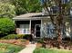 Charming two-story townhome featuring brick accents and a well-maintained front yard at 10875 Holly Ridge Blvd, Charlotte, NC 28216