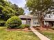 Charming two-story townhome featuring brick accents and a well-maintained front yard at 10875 Holly Ridge Blvd, Charlotte, NC 28216