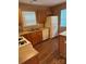 Cozy kitchen featuring appliances, wood cabinets, and laminate countertops at 10875 Holly Ridge Blvd, Charlotte, NC 28216