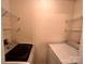 This laundry room features modern washer and dryer with wire shelving at 10875 Holly Ridge Blvd, Charlotte, NC 28216