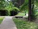 A peaceful walkway through a neighborhood park at 10875 Holly Ridge Blvd, Charlotte, NC 28216