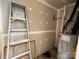 Water heater with ladder sitting in an unfinished room at 10875 Holly Ridge Blvd, Charlotte, NC 28216