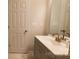 Bathroom with grey vanity, gold faucet and marble floor tiles at 2668 Meadow St, Gastonia, NC 28056