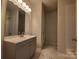 Modern bathroom with a sleek vanity, updated lighting, and a tiled shower at 2668 Meadow St, Gastonia, NC 28056