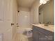 Bright bathroom with a white subway-tiled shower and modern vanity at 2668 Meadow St, Gastonia, NC 28056