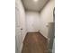 Hallway with hardwood floors leading to a white exterior door at 2668 Meadow St, Gastonia, NC 28056