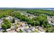 Aerial view of a vibrant residential neighborhood surrounded by lush greenery at 159 Badin Lake Cir, New London, NC 28127