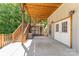 Spacious back patio with stairs leading to deck and convenient storage shed at 159 Badin Lake Cir, New London, NC 28127