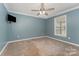 Bedroom featuring neutral carpet, a ceiling fan and natural light from the window at 159 Badin Lake Cir, New London, NC 28127