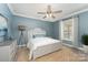 A furnished bedroom offers a peaceful retreat with decor that inspires tranquility at 159 Badin Lake Cir, New London, NC 28127