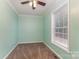 This bedroom features neutral carpet, a ceiling fan and great natural light at 159 Badin Lake Cir, New London, NC 28127