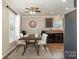 This dining room features a table with seating for six and views to the Kitchen at 159 Badin Lake Cir, New London, NC 28127