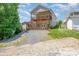 Multi-story home with a fenced yard, upper and lower decks and gravel area at 159 Badin Lake Cir, New London, NC 28127
