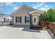 Charming single-story home showcasing a welcoming front porch and a large concrete driveway at 159 Badin Lake Cir, New London, NC 28127