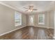 Inviting living room with wood floors, neutral walls, and a decorative front door with glass accents at 159 Badin Lake Cir, New London, NC 28127