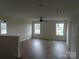 Bright bonus room with wood floors, ceiling fan, and multiple windows at 1145 Philbeck Rd # 11, York, SC 29745