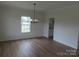 Bright dining room with chandelier and hardwood floors at 1145 Philbeck Rd # 11, York, SC 29745
