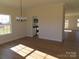 Light-filled dining room with hardwood floors and chandelier at 1145 Philbeck Rd # 11, York, SC 29745